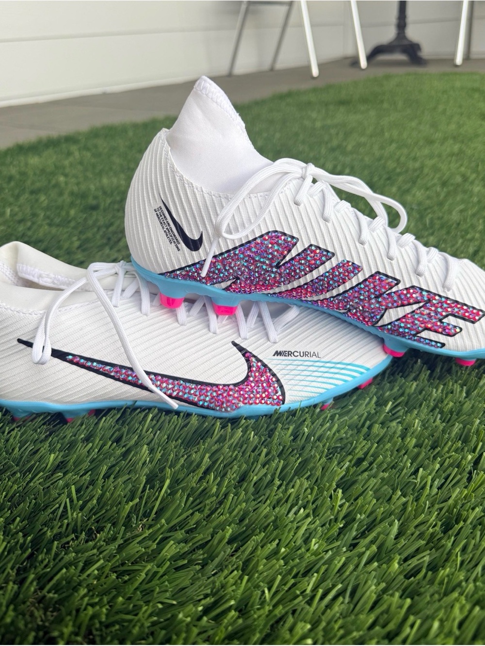 Nike Women’s White Soccer Cleats with Pink and Blue Accents
